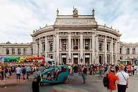 Rainbow Parade on City Hall Square with a view of the Burgtheater 