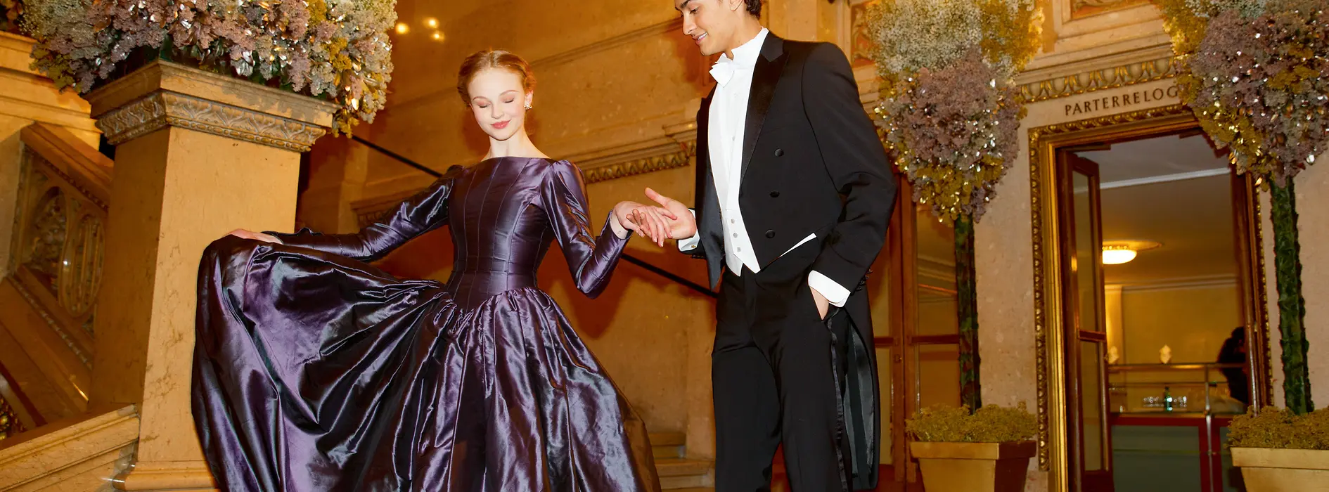 Couple in evening dresses at the Vienna State Opera