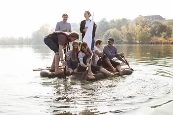 Group on raft in water