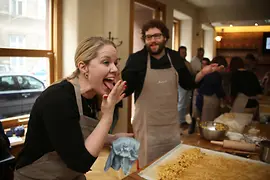 Two people baking an apple strudel