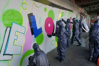Groups sprays walls with Graffiti
