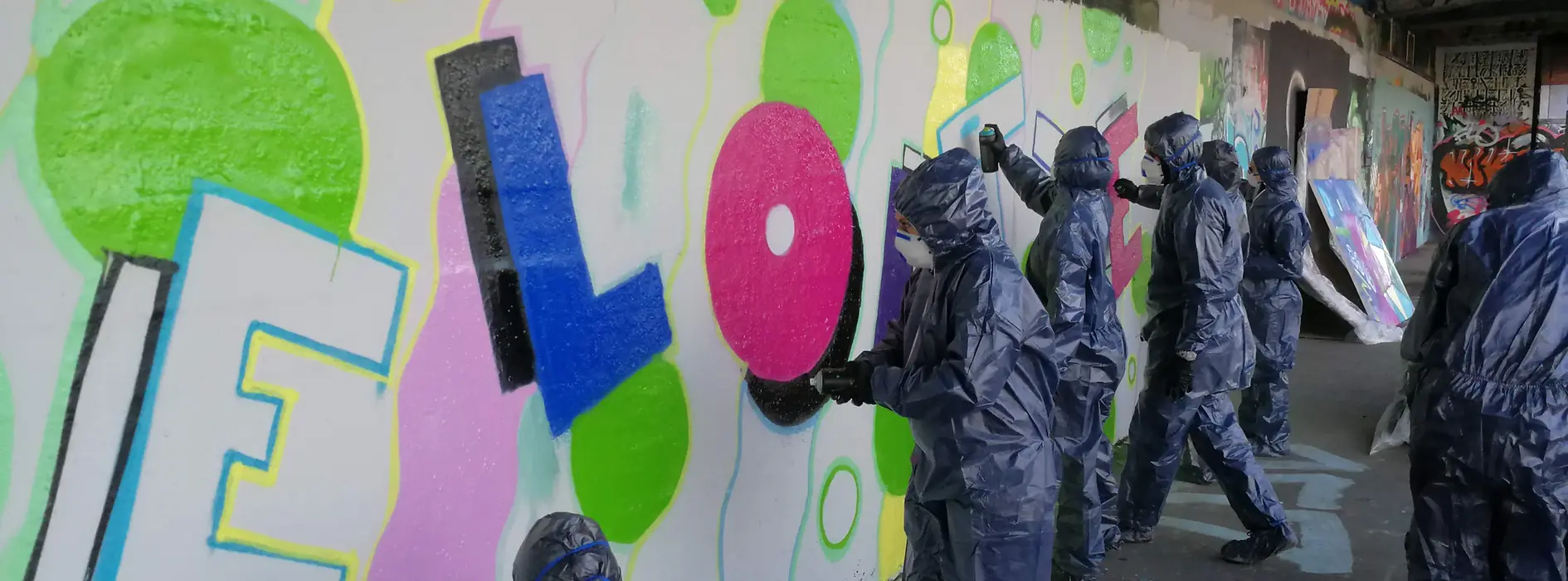 Groups sprays walls with Graffiti