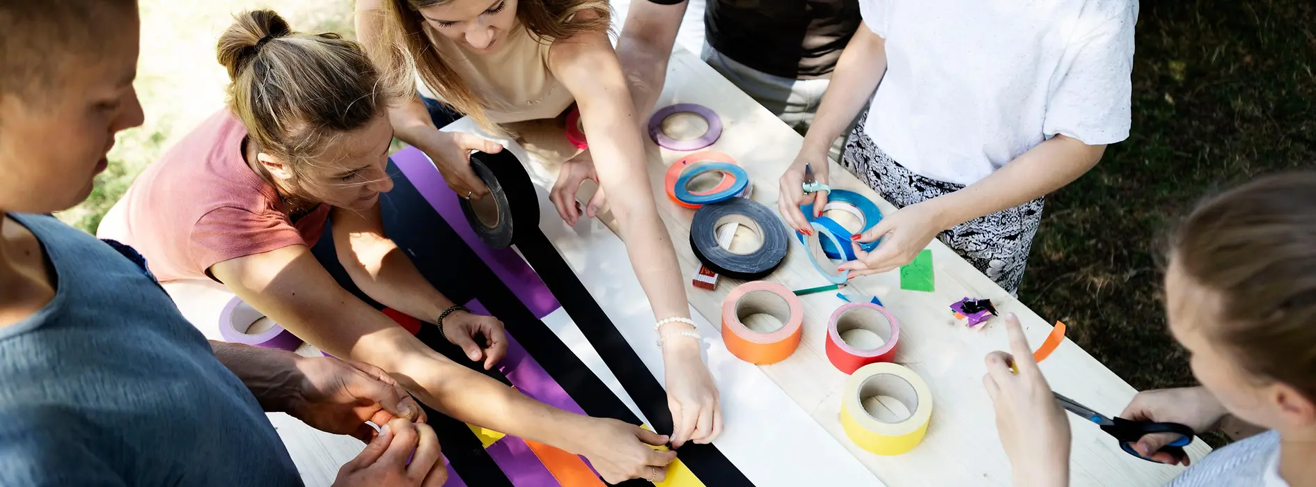 A group makes a picture from tape