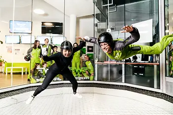 Two people in a wind tunnel