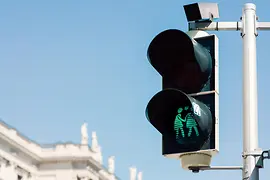 Green traffic light with a same-sex couple