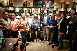 Group picture in a wine cellar