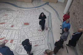 People at old city map of Vienna
