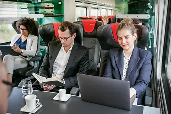 Business travellers on ÖBB train