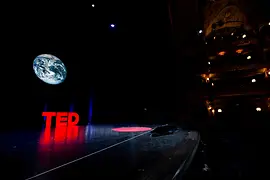 TED Logo on a dark stage