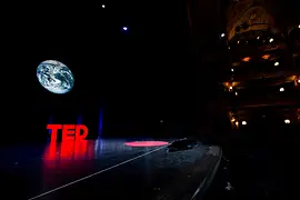 TED Logo on a dark stage