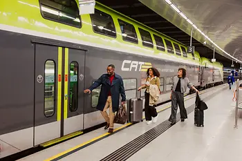 Two ladies and a gentleman boarding the airport express train City Airport Train. 