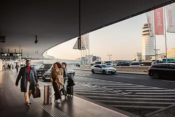 People in front of the airport building