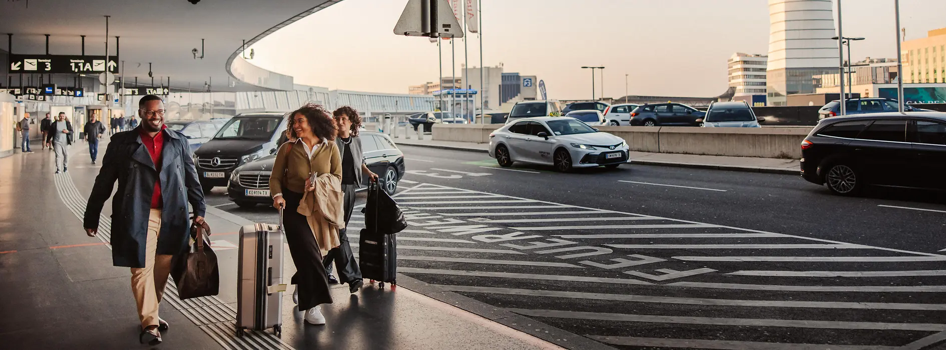 People in front of the airport building