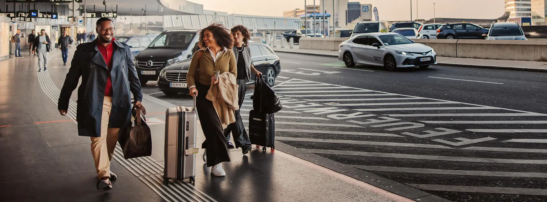 People in front of the airport building